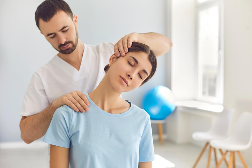 Chiropractor treating whiplash injury