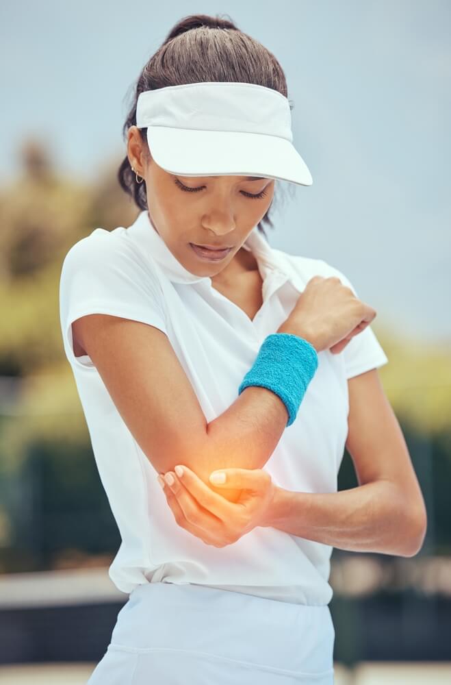 lady with elbow pain from sports