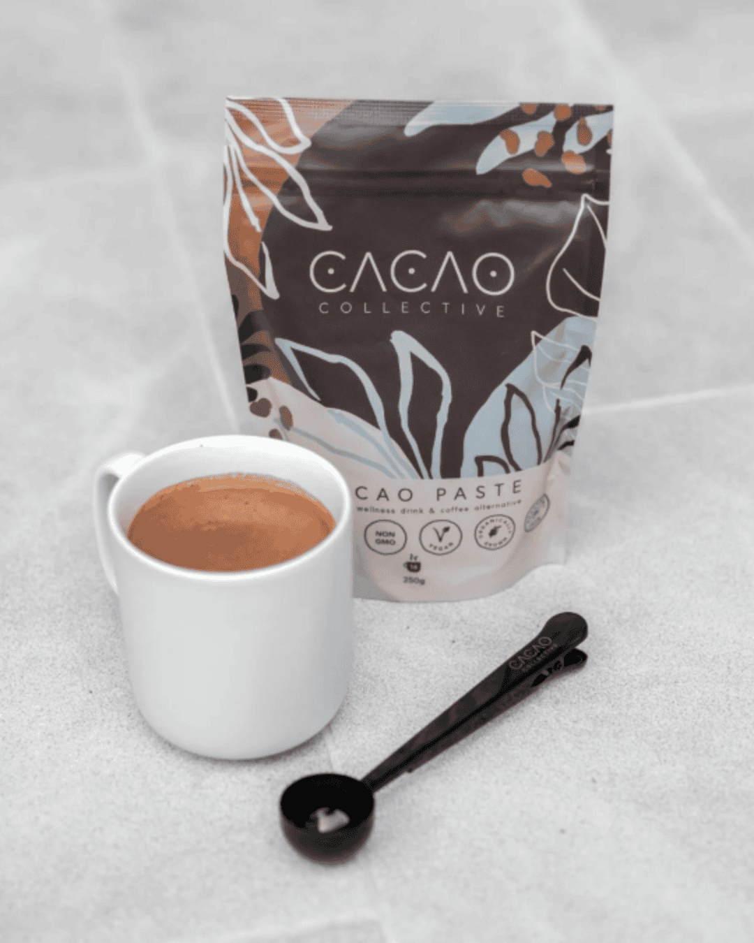 image of cacao powder with mug and mixing spoon